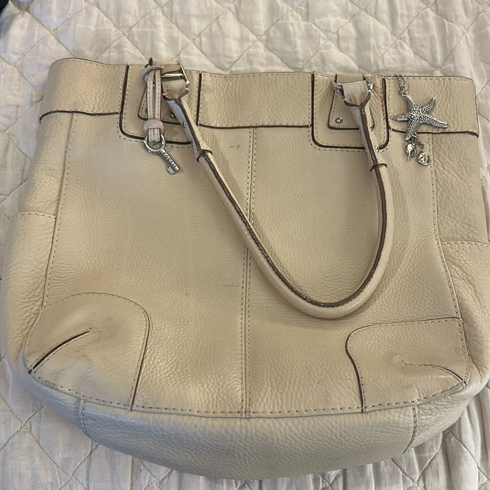 Fossil bag with starfish charm